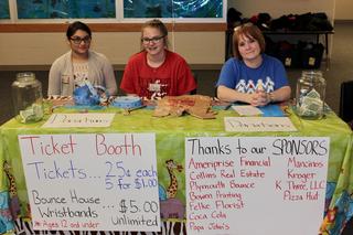 PHS Students and Teri Zechiel working welcome table.