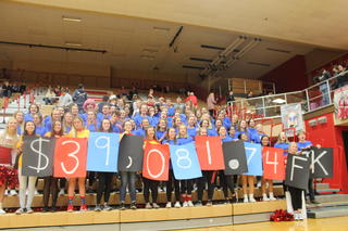 PHS Students with dance marathon fundraising total.