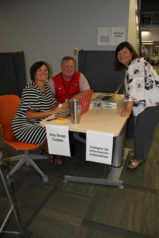 Staff Lauren Cooper, Craig Hopple, and Becky Walters helping at registration.