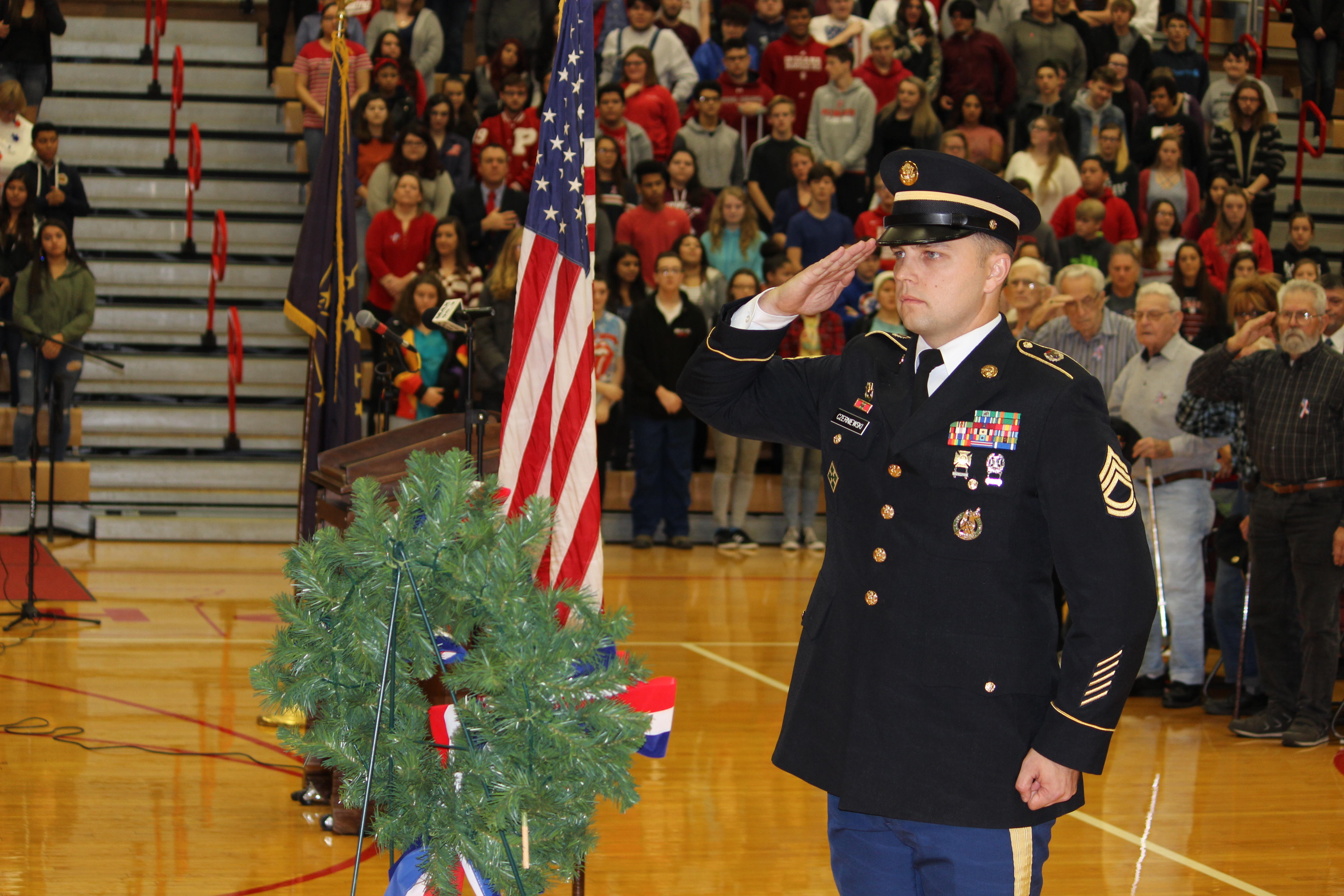 Service man presenting the wreath for Veterans Day.