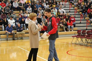 Mrs. Portteus and PHS student receiving award.