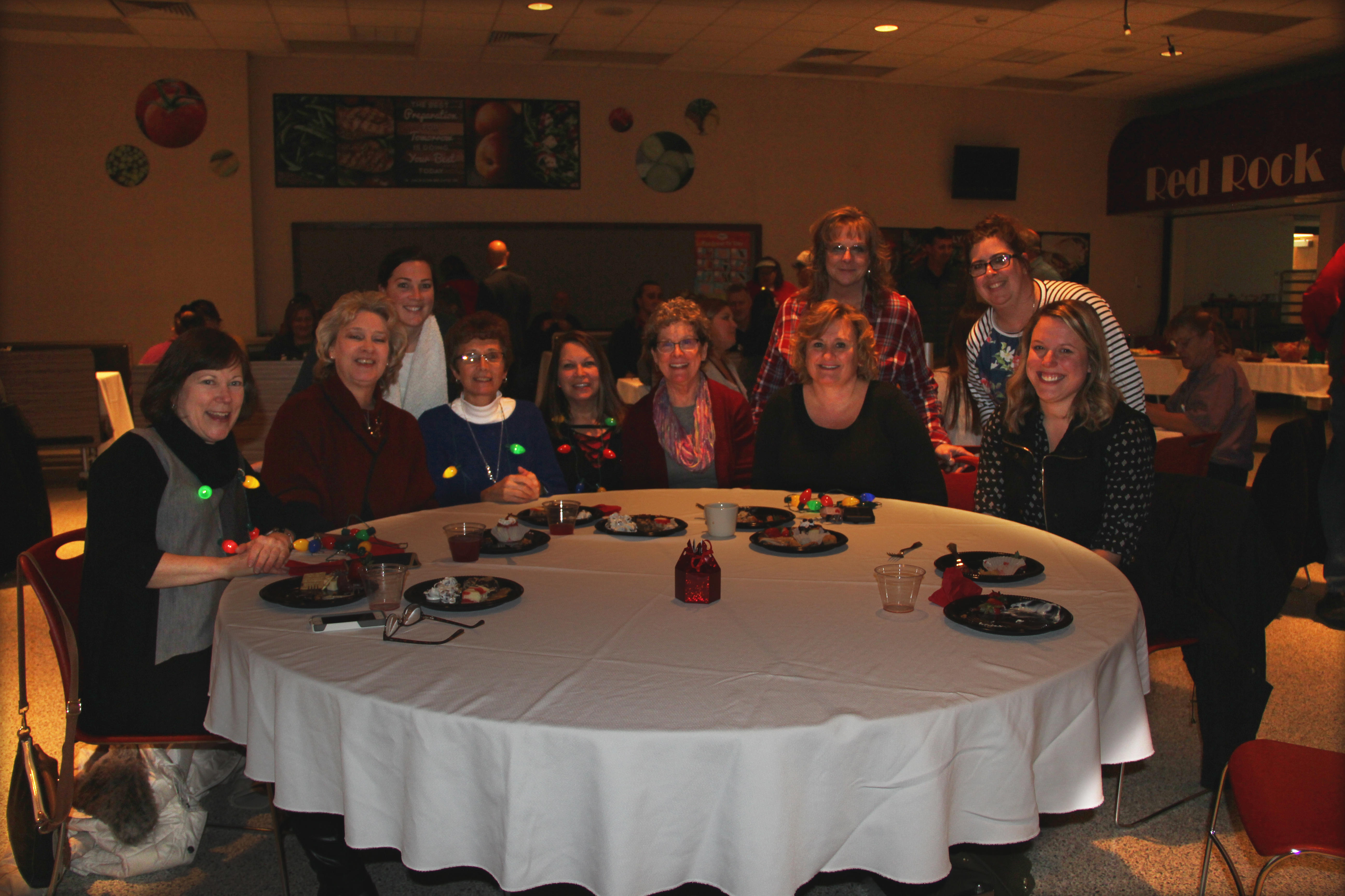 photo of Susie Kreighbaum and her Webster colleagues taken at this year’s PCSC holiday party at Plymouth High School on Dec. 12, 2018